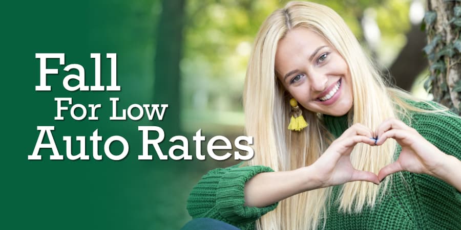 A smiling blonde woman making the shape of a heart with her hands. At the left, the words: fall for low auto rates