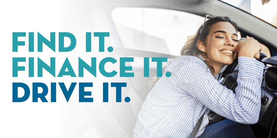 A woman hugging the steering wheel of a new car. The words on the left: Find It. Finance It. Drive It.