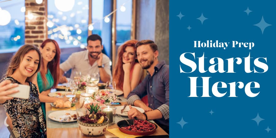 A party of five taking a picture at a holiday dinner table. At the right, the words: holiday prep starts here