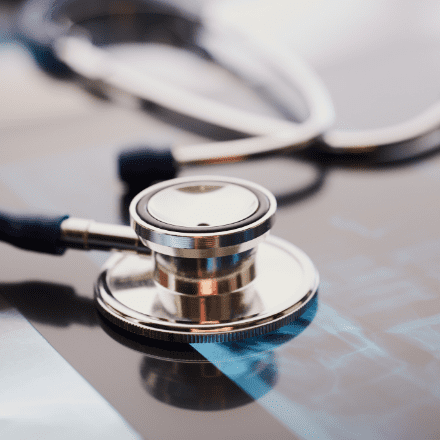 A stethoscope resting on a table.