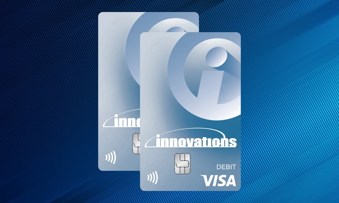 Two Innovations Visa Debit cards against a pattern background.