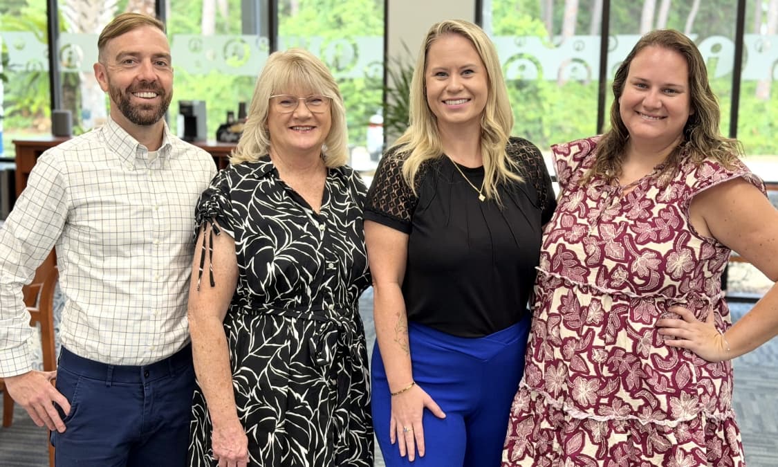 The Middle Beach Branch staff with smiling faces.