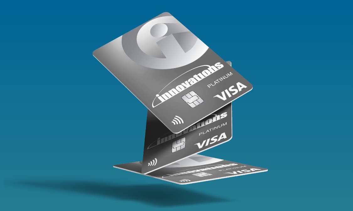 Three stacked Innovations Platinum Visa credit cards displayed in a floating arrangement against a blue background.