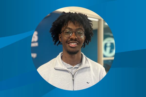 Profile of Kyran Batson against a pattern background.